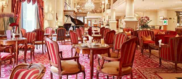 Grand Hotel Wien lounge with grand piano for VIP corporate hospitality and networking events.