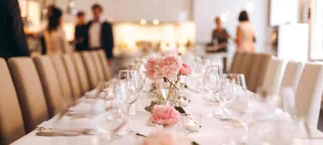 Elegant long-table banquet setup at The Vault Vienna for high-end event or wedding venue.