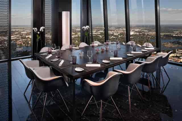 Modern private dining room with floor-to-ceiling views for executive meetings and VIP dinners.