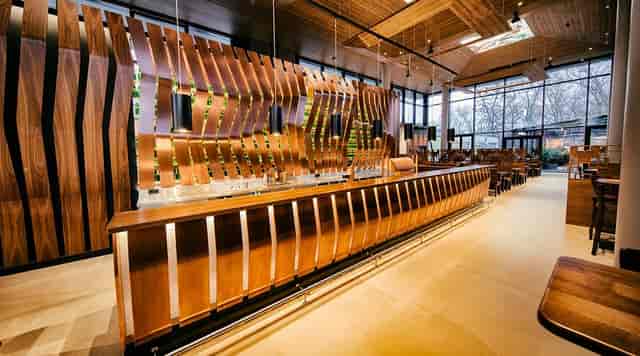 Contemporary Donaubräu indoor bar with warm architectural design for upscale cocktail receptions.