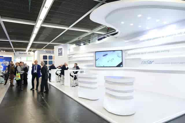 Minimalist trade show booth at D3 Convention Center, modular design for B2B networking events.