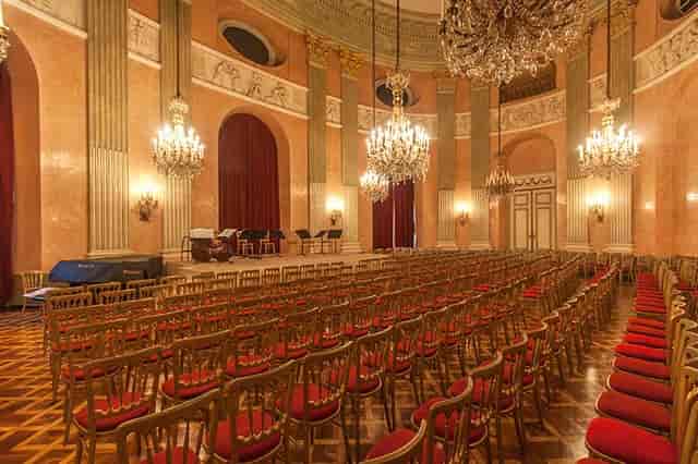 Theater-style Rosenkavalier Saal with chandeliers for formal concert or conference venue hire.