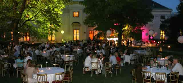 Palais Auersperg evening reception with architectural lighting for luxury corporate events.