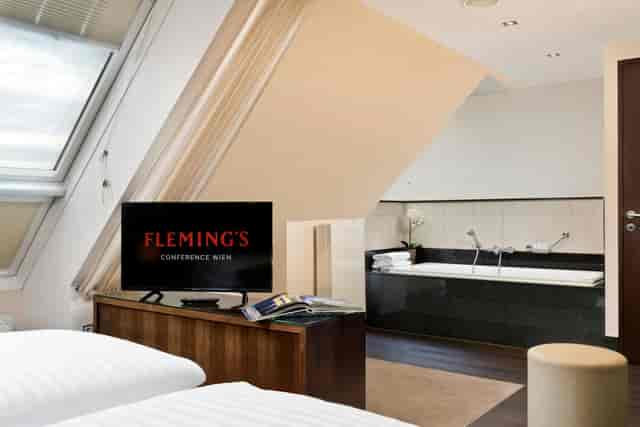 Luxury hotel room with open-concept bathtub for executive conference VIP retreats.