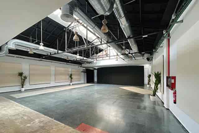 Industrial-chic event venue with high ceilings for creative workshops and product launches.