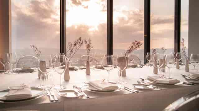 High-end banquet dining area at sunset, perfect for luxury events and wedding venue photography.