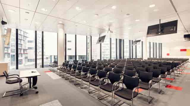 Modern theater-style conference room at ThirtyFive for corporate lectures and business events.