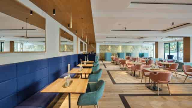 Contemporary cafe event space at Hotel Maximilian for corporate dining and networking.