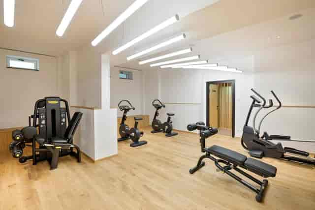 Modern hotel fitness center at Hotel Maximilian for corporate wellness and business travel.