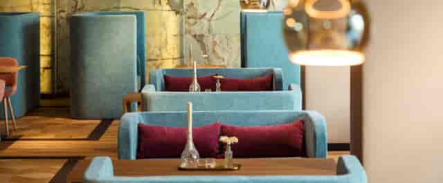 Luxury lounge booth seating at Hotel Maximilian for intimate networking and VIP events.