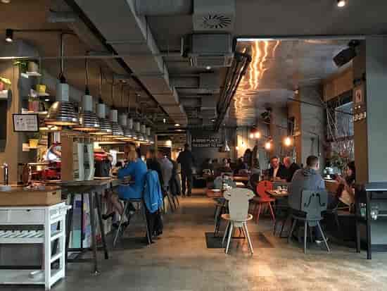 Industrial-chic 25hours Hotel restaurant for post-conference networking and corporate events.