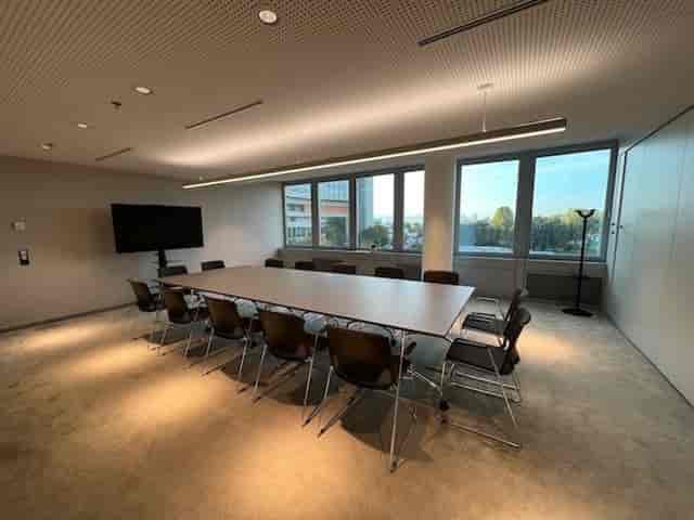 IZD Tower boardroom with rectangular table for business meetings and project briefings.
