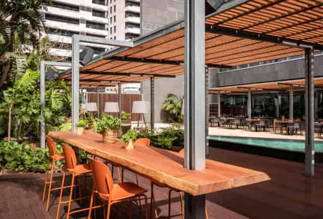 Hotel SB Diagonal terrace with communal table for corporate networking and business events.