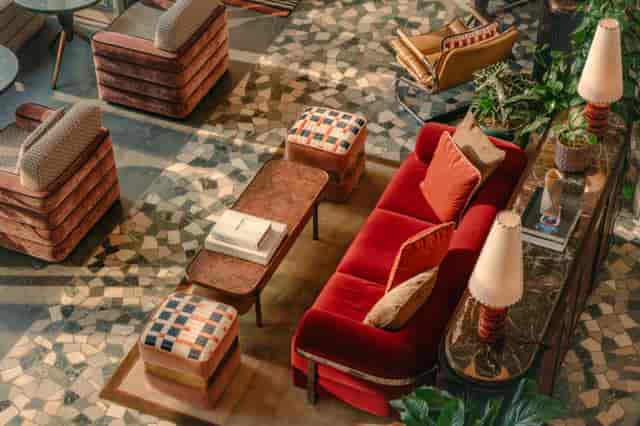 Plush seating in The Hoxton Vienna lobby, ideal for high-end corporate events and VIP networking.