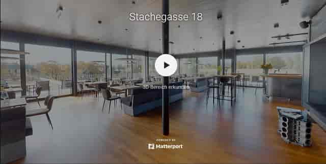 M12 Eventlocation Vienna: Modern rooftop bar with floor-to-ceiling windows for event planning.