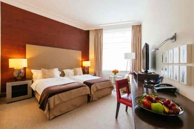 Radisson Blu Style Hotel Vienna boardroom with twin beds for corporate conferences and events.