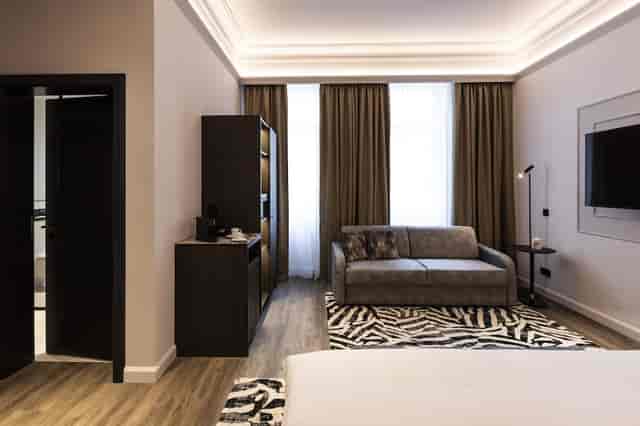 O11 Boutique Hotel junior suite with coffee station for VIP meetings and corporate event breakout.