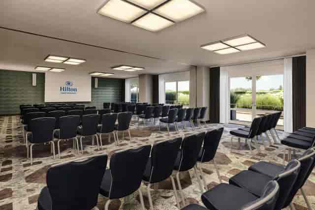 Hilton Vienna Waterfront theater-style meeting room for corporate events and professional training.