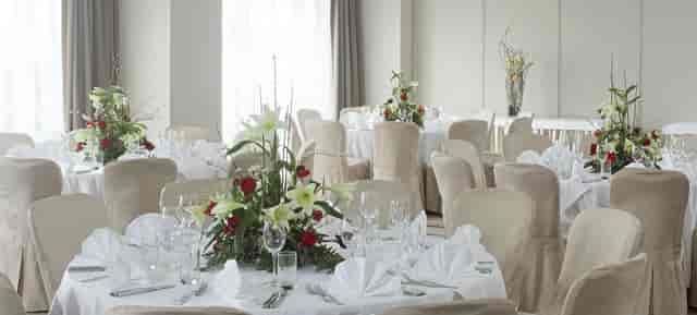 Banquet hall at Hilton Vienna Waterfront with elegant floral decor for upscale events.