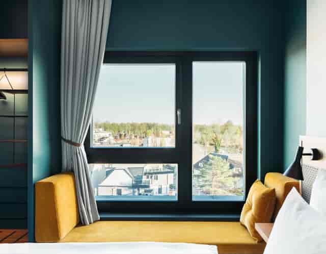 Smart Garden Room with window nook for bleisure travel and conference stays.
