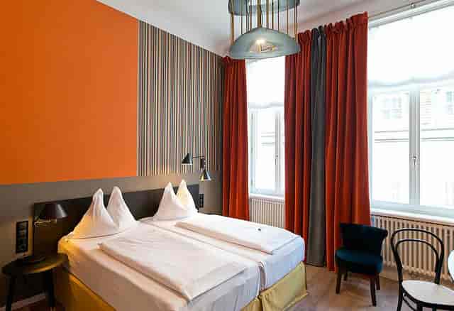 Modern boutique hotel room for conference attendees and VIP speakers.
