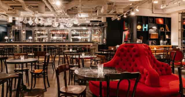 Ruby Lissi Hotel event space with red seating, ideal for urban corporate receptions and networking.