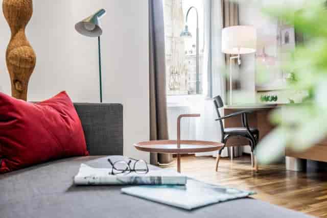 Boutique hotel suite with executive workspace for business travel and meetings.
