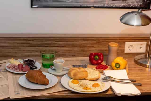 Senator Hotel room breakfast setup for solo business travel and conference stays.