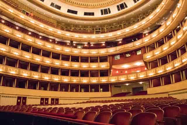 Vienna State Opera auditorium with tiered theater seating for prestigious award ceremonies.
