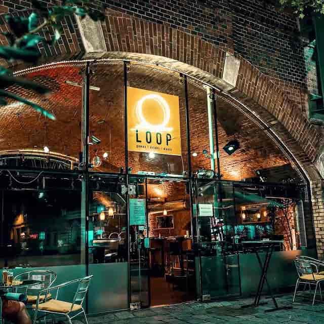 Industrial-chic lounge in a historic archway for evening networking events and receptions.