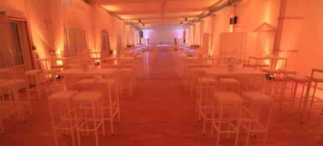 Spectacula event space with high-top tables for networking receptions and cocktail hours.