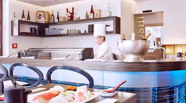 Luxury sushi bar at UNKAI restaurant, ideal for VIP corporate networking and executive dinners.