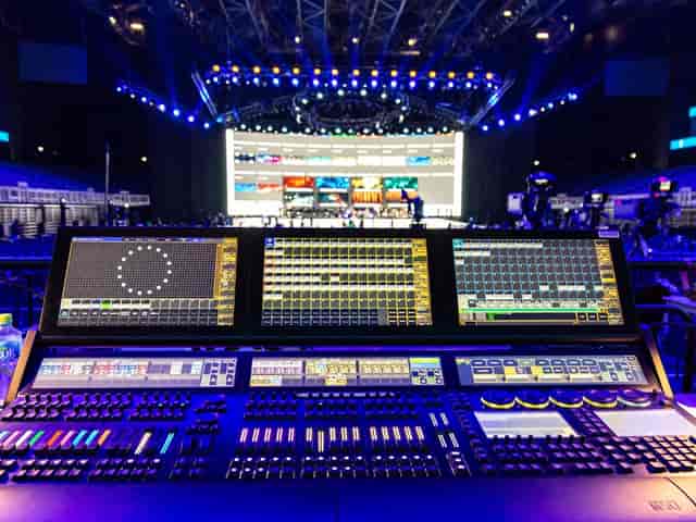 Encore Vienna AV console and lighting rig for immersive corporate event production.