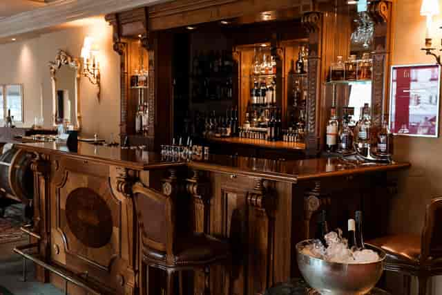 Upscale Kavalierbar Wagemut venue with wood decor for VIP networking and corporate reception.