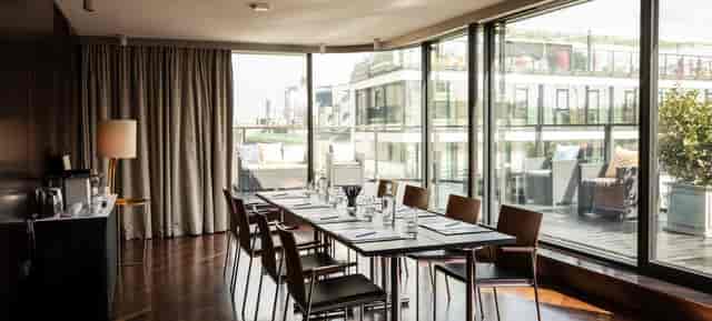 Hotel Topazz Lamee boardroom with floor-to-ceiling windows for intimate corporate event meetings.