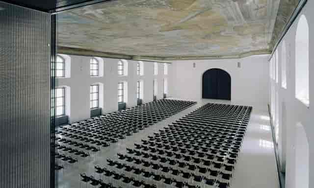 Säulenhalle venue with frescoed ceiling, ideal for corporate summits and professional conferences.