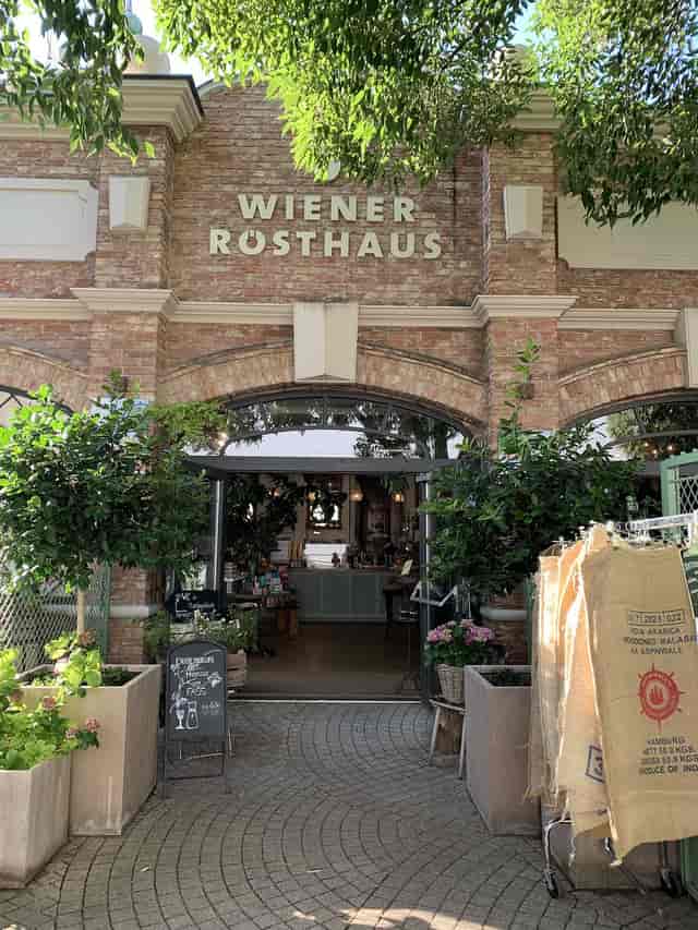 Brick-clad entrance of Theater im Prater cafe for corporate receptions and brand activations.