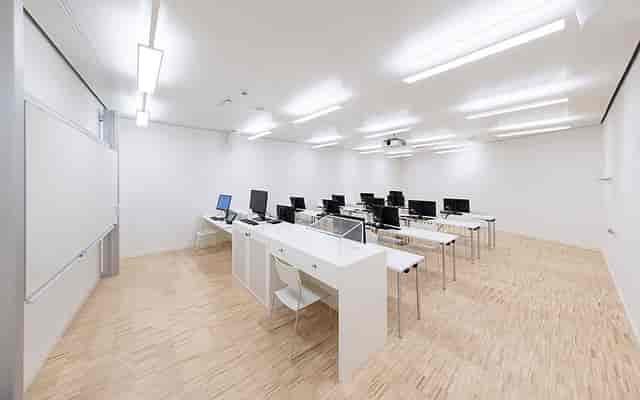 Minimalist computer training room at CUBE14 for technical workshops and corporate seminars.