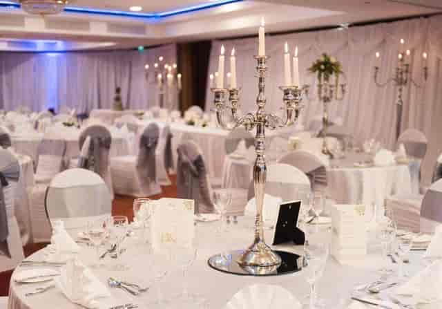 Elegant banquet hall at Radisson Blu Dublin set for a wedding gala with silver candelabras.