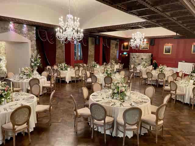Opulent Cabra Castle ballroom with crystal chandeliers for luxury wedding and gala events.