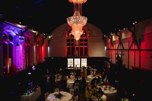 Thomas Prior Hall gala venue with dramatic uplighting and chandelier for upscale event celebrations.