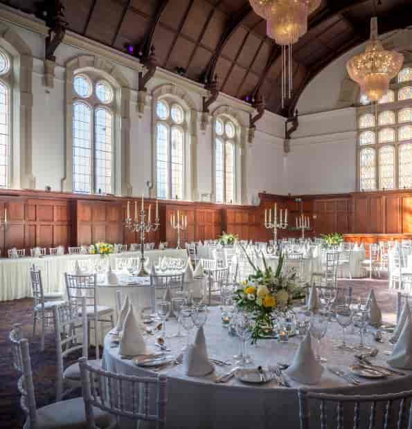 Grandstand Restaurant venue with wood paneling for formal wedding banquet and event reception.