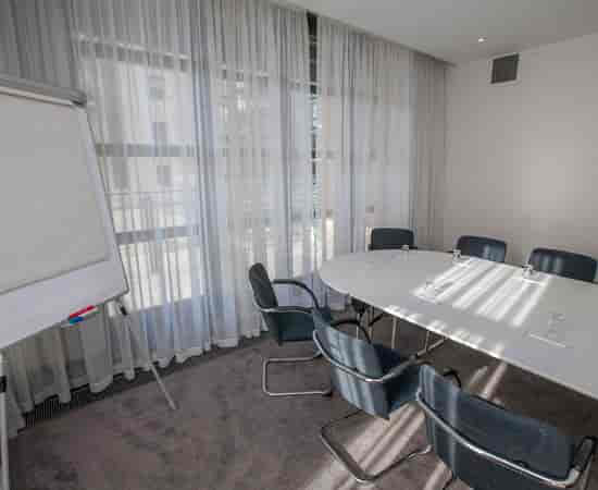 Boardroom setup at The Spencer Hotel Club Lounge, ideal for team meetings and client consultations.
