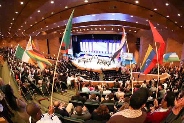 Large-scale conference auditorium for international congress and plenary session event.