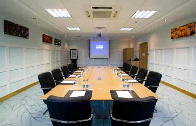 Boardroom-style meeting room for corporate events and professional conferences.