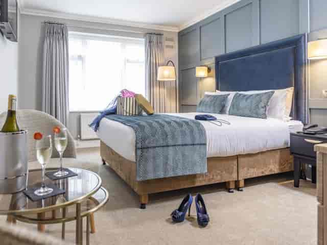 Upscale hotel room for VIP incentive travel or corporate event accommodation.