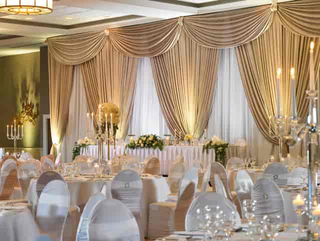 Elegant gala ballroom at Fairways Convention Centre with sophisticated candelabra wedding decor.