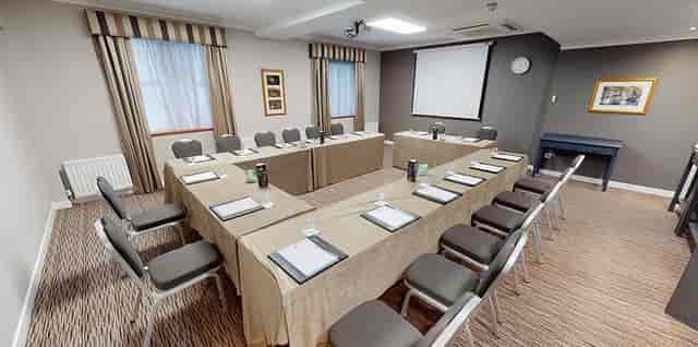 U-shape meeting room with ergonomic seating at Ashling Hotel for corporate training and strategy.