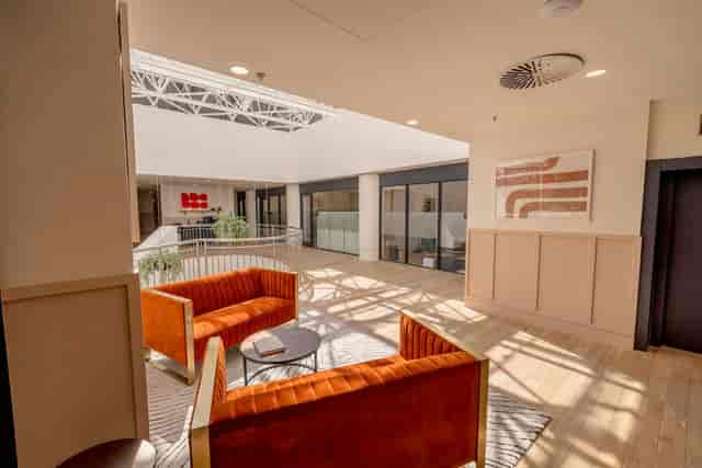Vibrant Smyth House breakout room with natural light for networking and corporate events.
