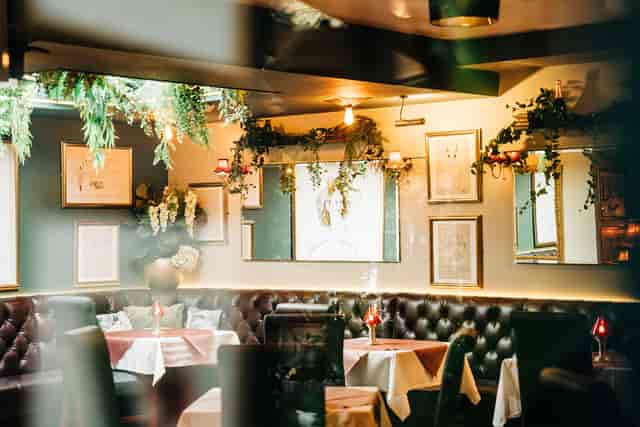 VIP networking space at Marco Pierre White Donnybrook with plush tufted banquettes.